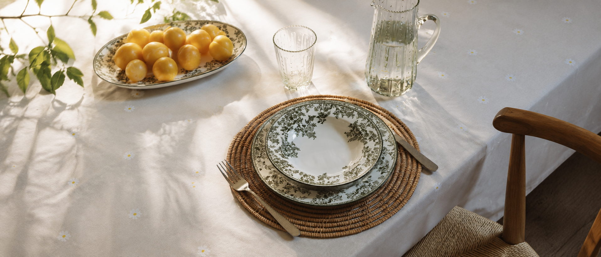 Sunlit table setting with elegant dinnerware