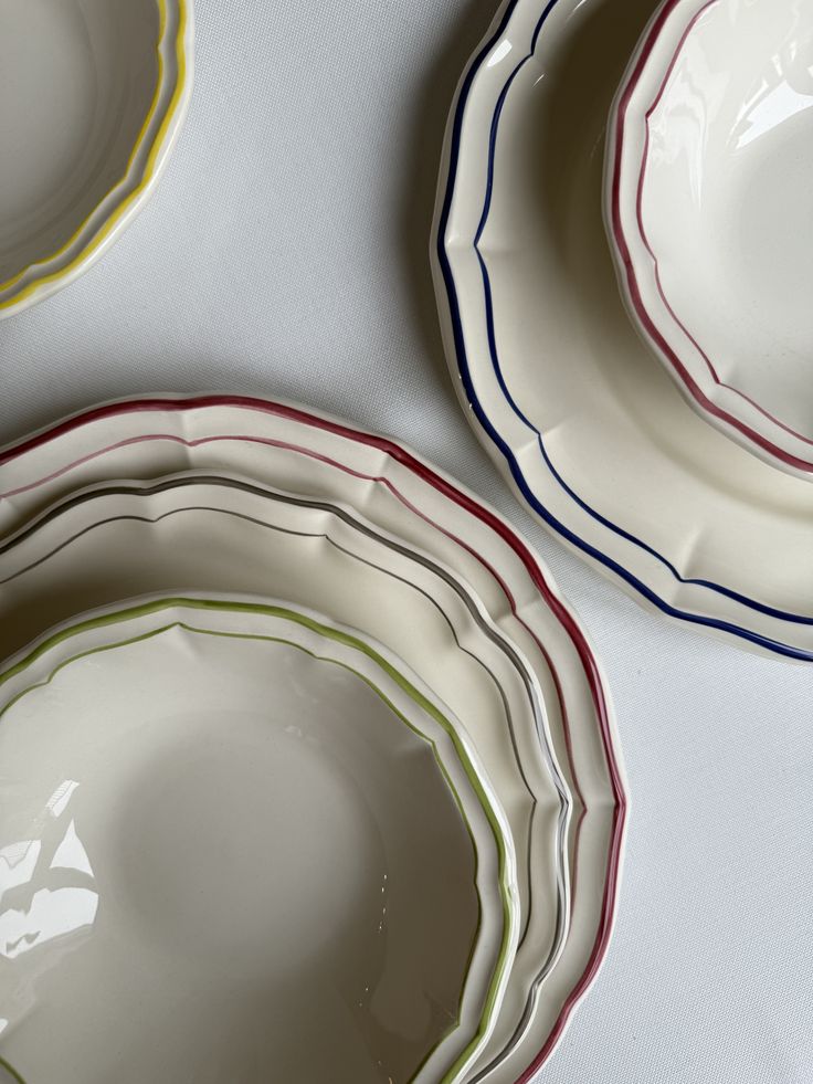 Decorative plates styled on a bright dining table